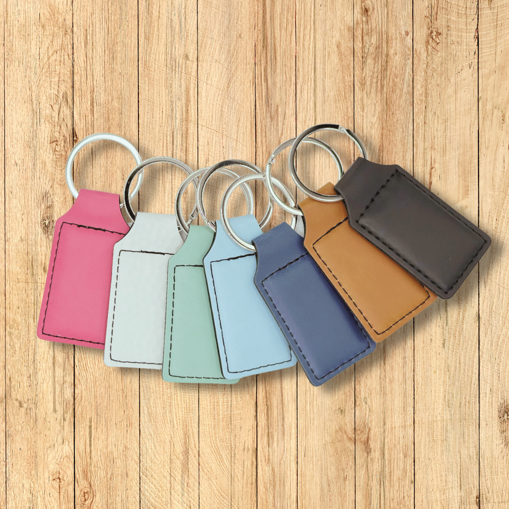 Larimer Supply Company premium leatherette keychains in a variety of colors